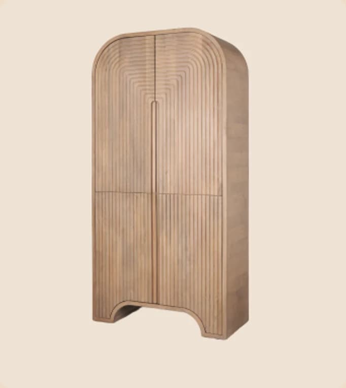 An arched wardrobe in fluted oak