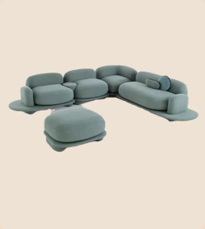 A teal modular sofa with rounded bolster cushions