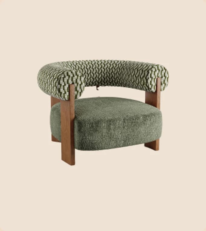 A green boucle armchair on oak legs