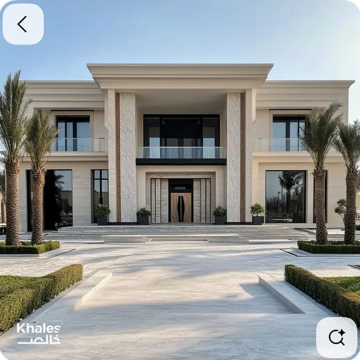 A pale stone villa frontage with palms