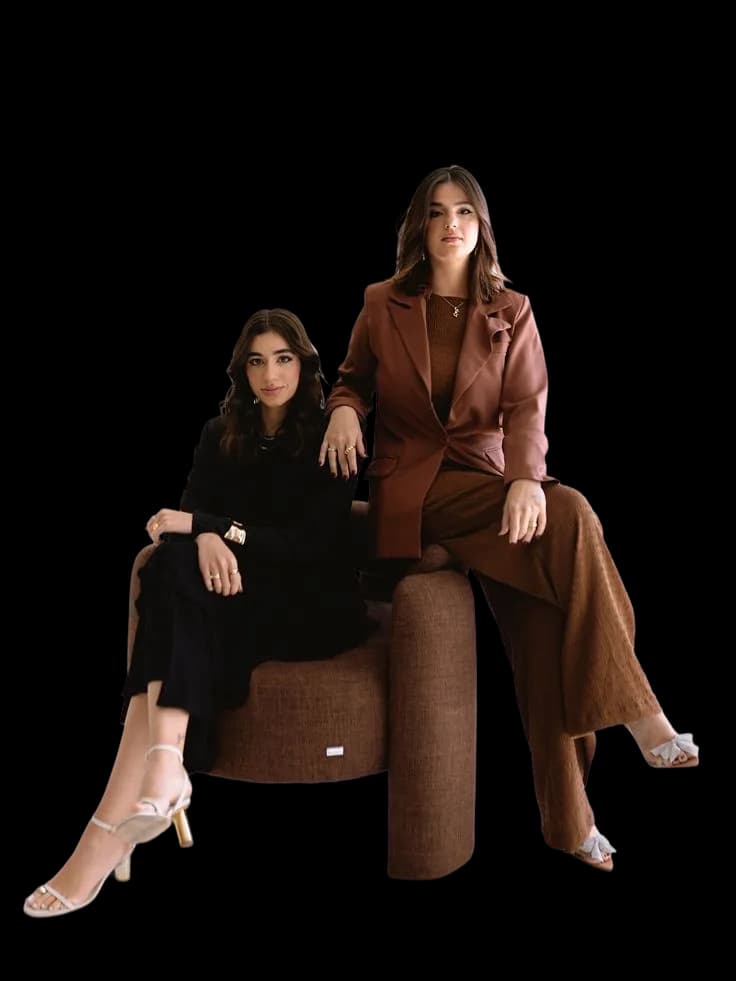 Two models in brown blazers