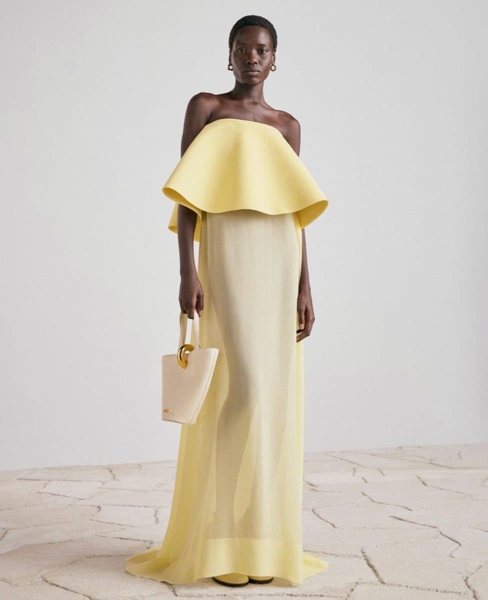 A pale yellow column gown with a ruffled collar