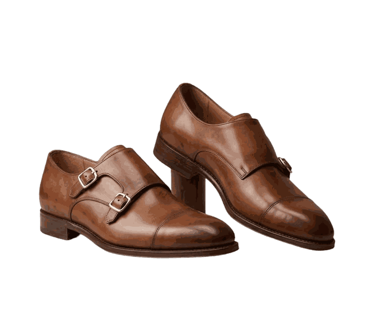 A pair of tan monk-strap shoes