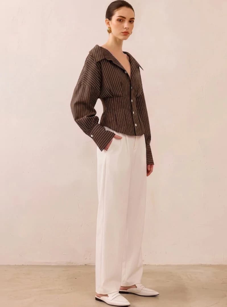 Brown pinstripe shirt worn with white trousers