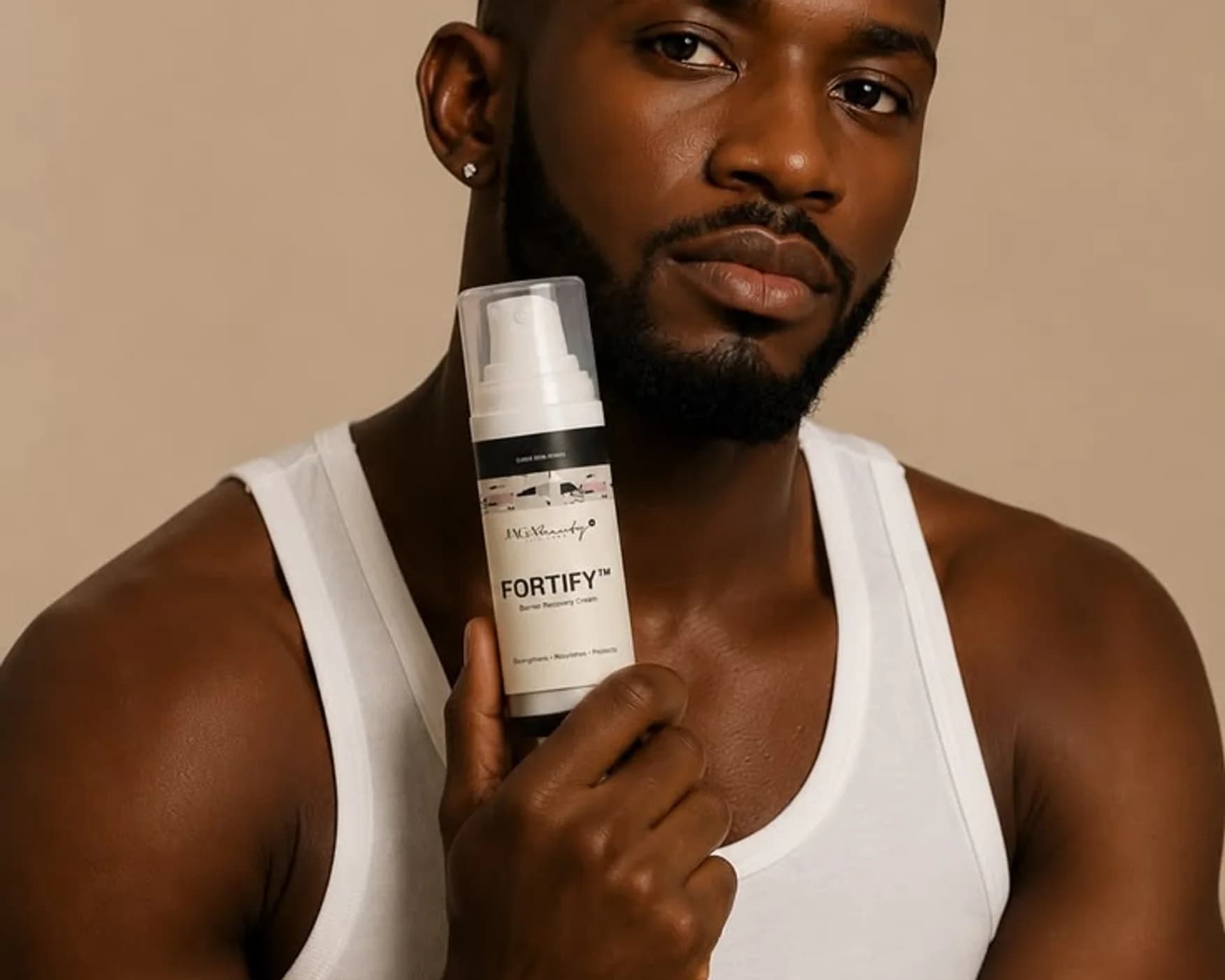 A model holding a bottle of skincare