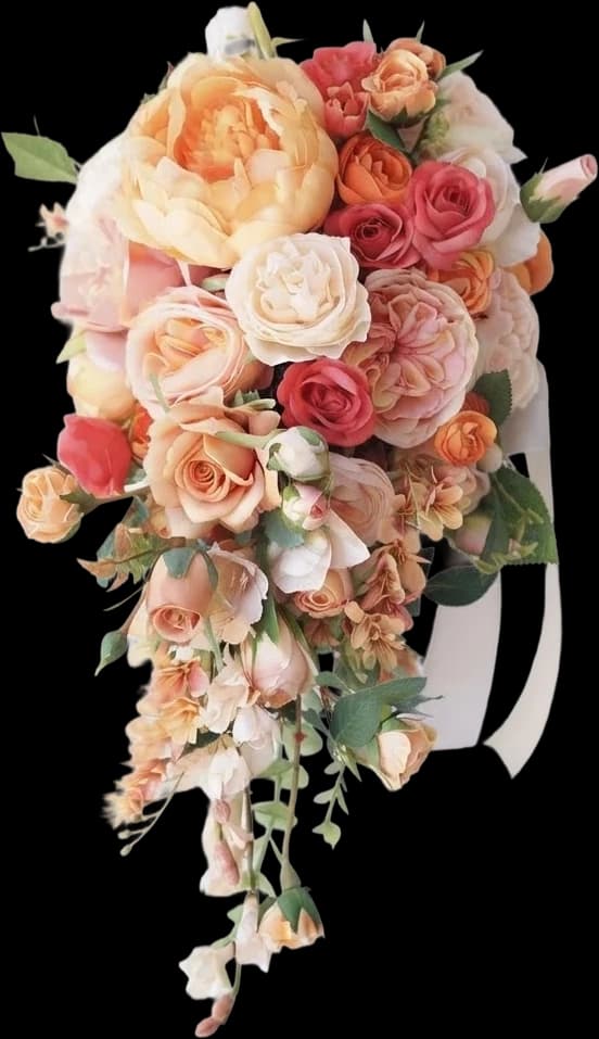 A cascading bouquet of peach garden roses and apricot ranunculus
