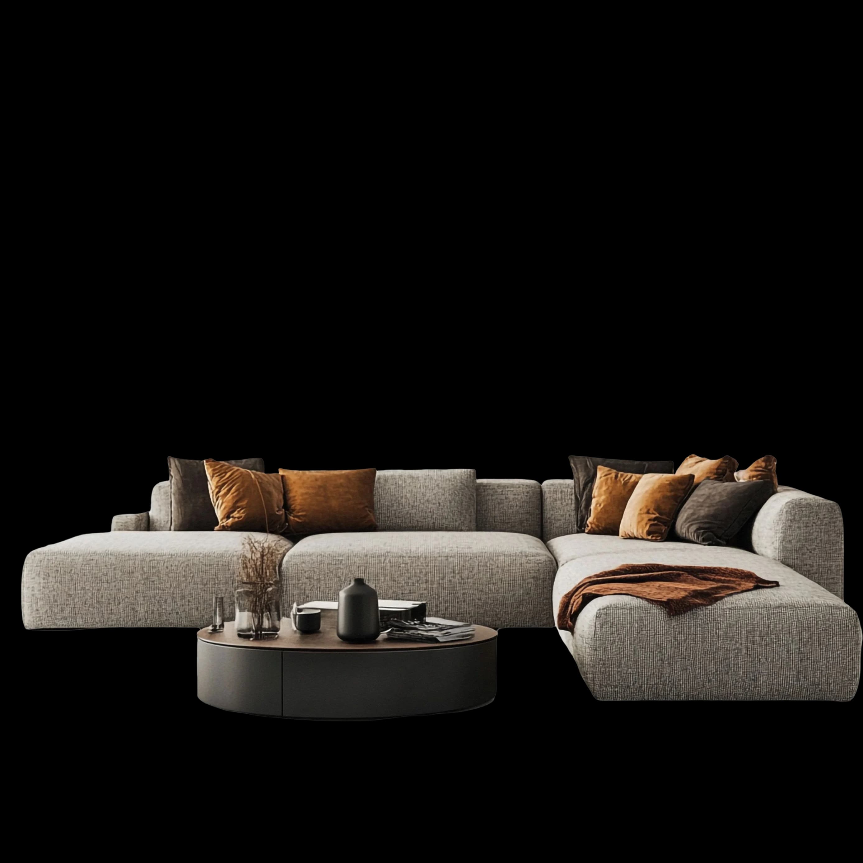 A large grey sectional dressed with amber and charcoal cushions