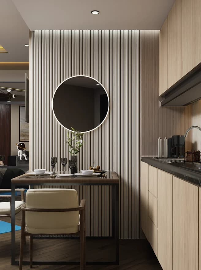 A fluted dining nook with a round mirror and upholstered chairs