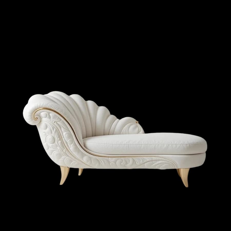An ivory chaise longue with a carved shell back