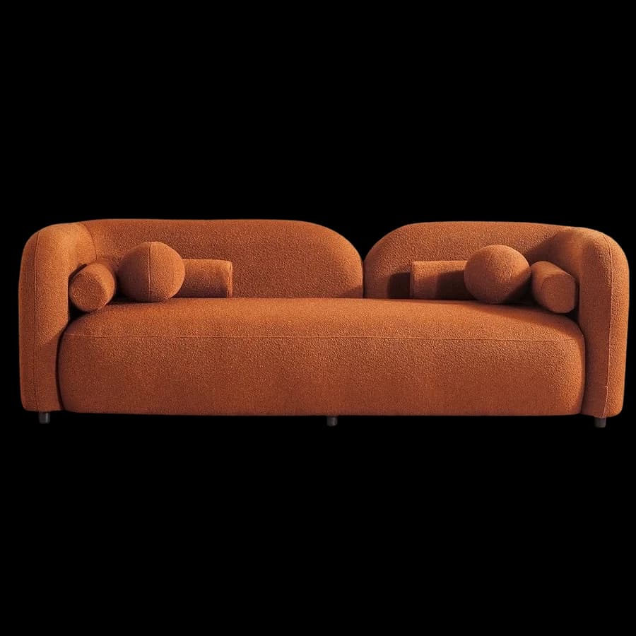 A curved three-seat sofa in rust bouclé with bolster cushions