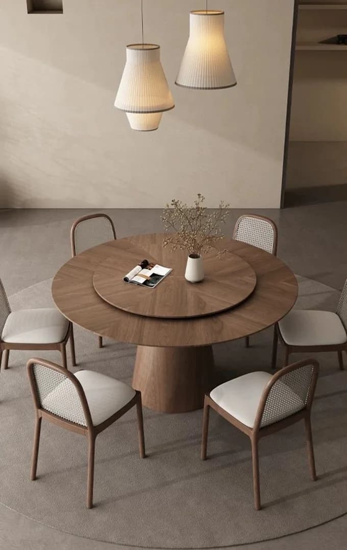 A walnut dining table laid for two