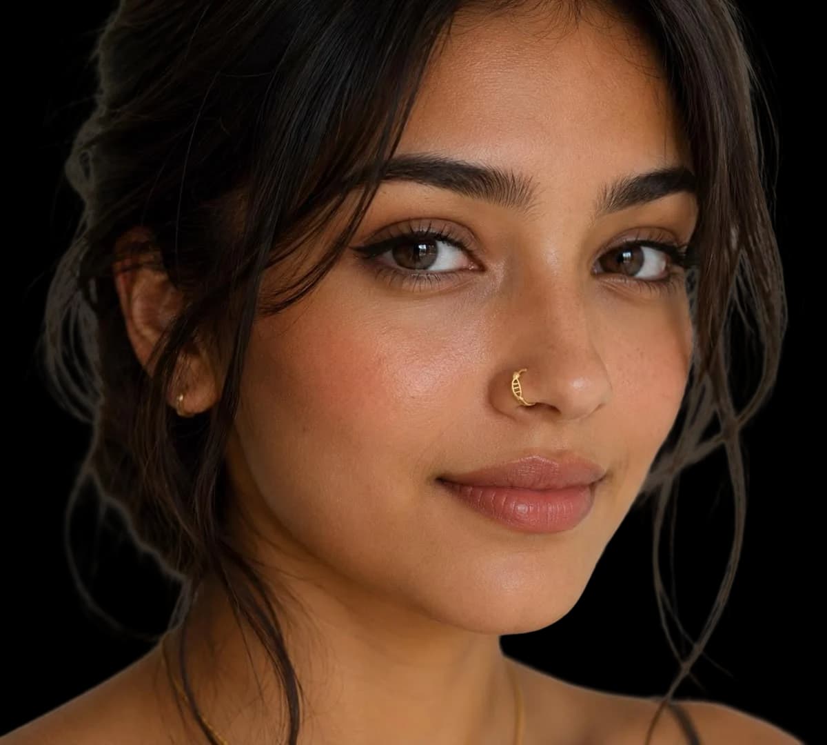A model wearing a fine gold nose stud