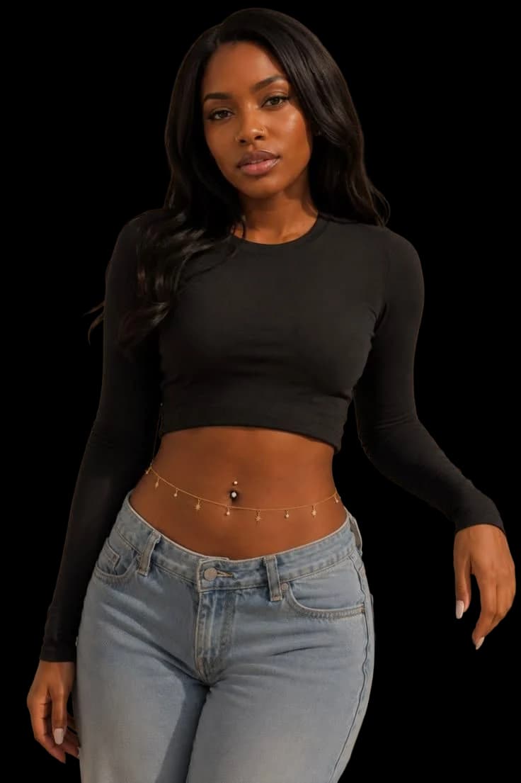 A charmed gold waist chain worn over denim