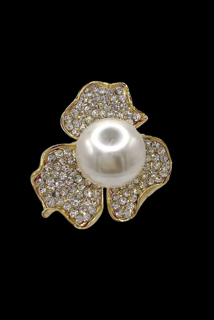 A pavé flower brooch with a pearl at its centre