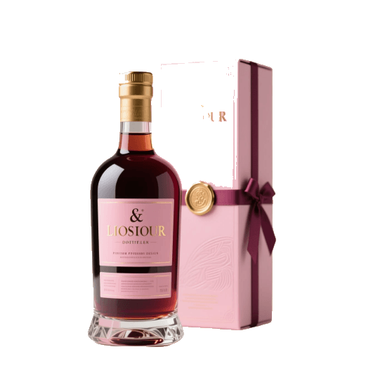 A red wine bottle beside a ribboned pink gift box