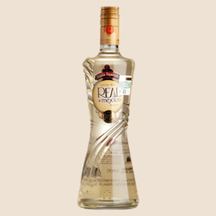 A tall fluted bottle of aged spirit with a gold collar