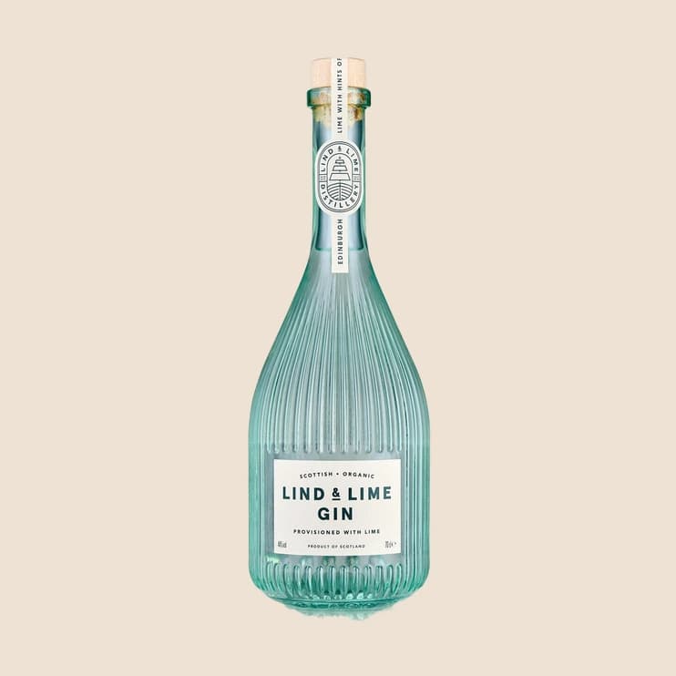 A ribbed teal gin bottle with a cork stopper