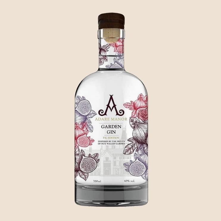 A clear gin bottle printed with pink garden flowers