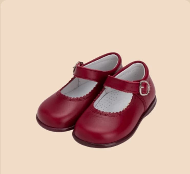 A pair of red patent bar shoes