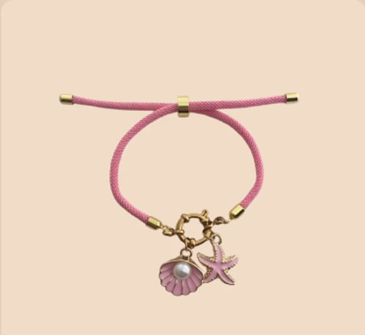 A pink cord bracelet hung with enamel charms