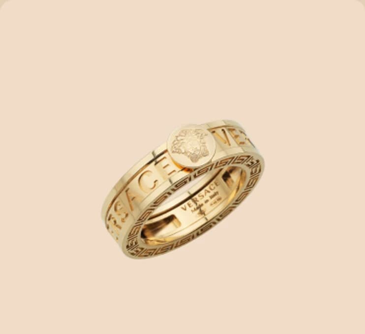 A gold band engraved around its face