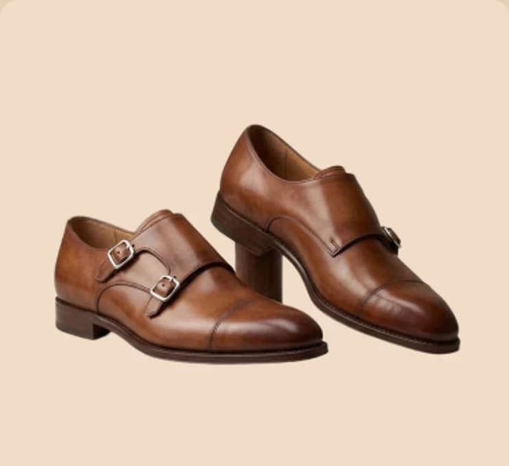 A pair of tan double-monk shoes
