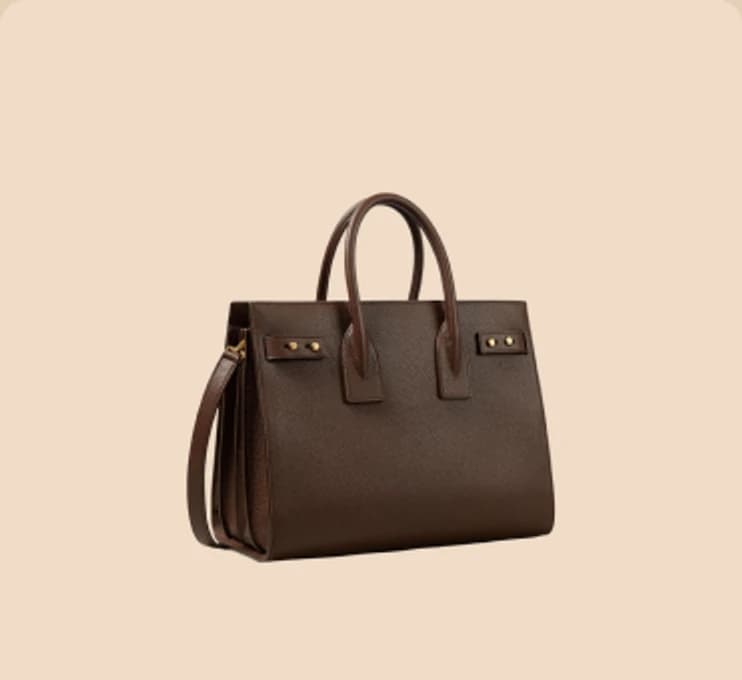 A dark brown leather tote with rolled handles