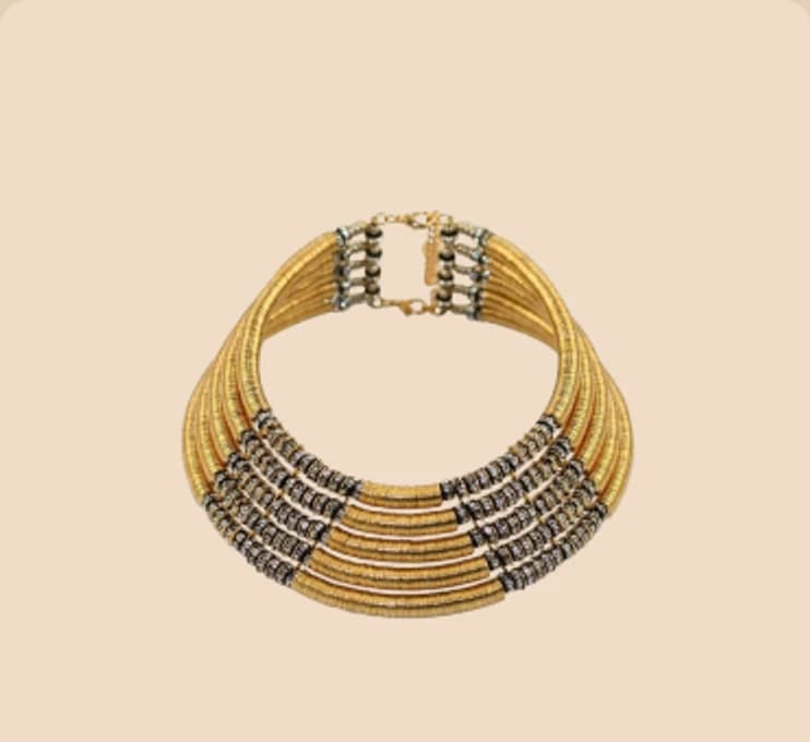 A gold multi-strand collar set with pavé panels