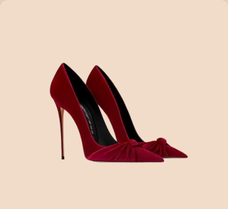 A pair of red velvet stiletto heels