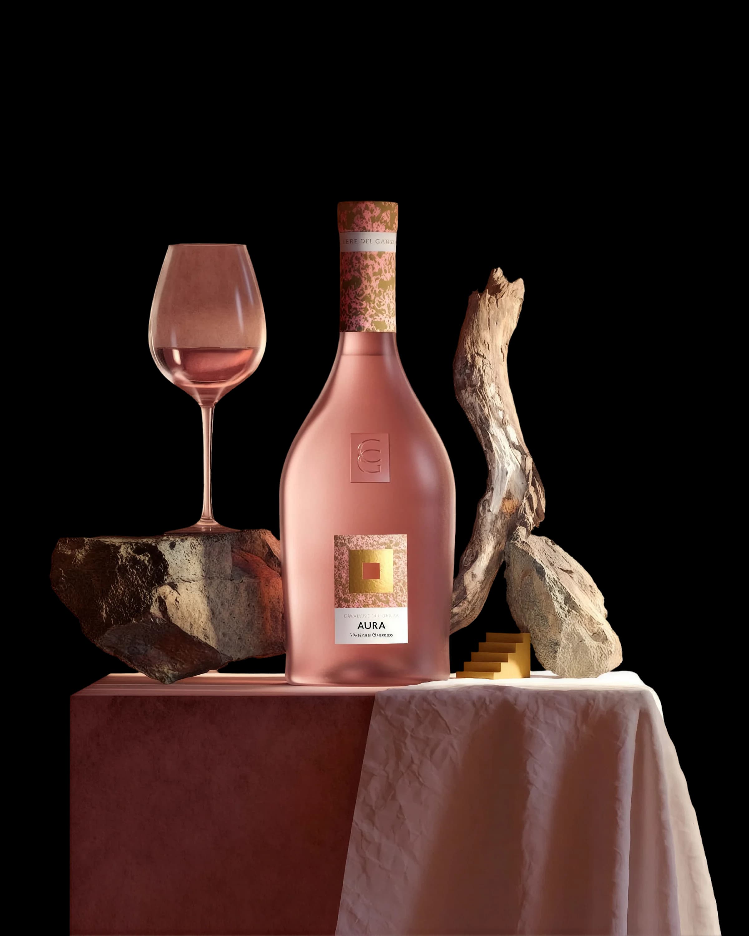 A decanter and a bottle standing on a lit stone ledge