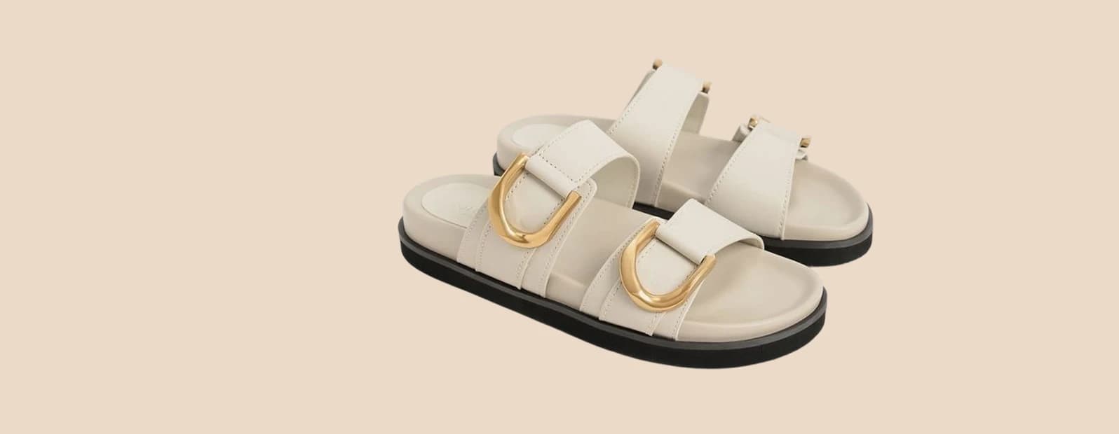 Cream leather slides on a moulded footbed with gold D-rings