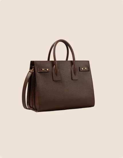 A dark brown leather tote with rolled handles