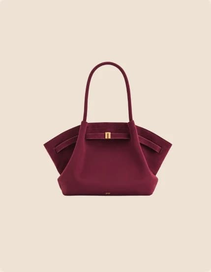 A burgundy leather shopper belted at the front