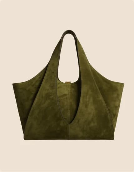 An olive suede tote with a deep curved opening