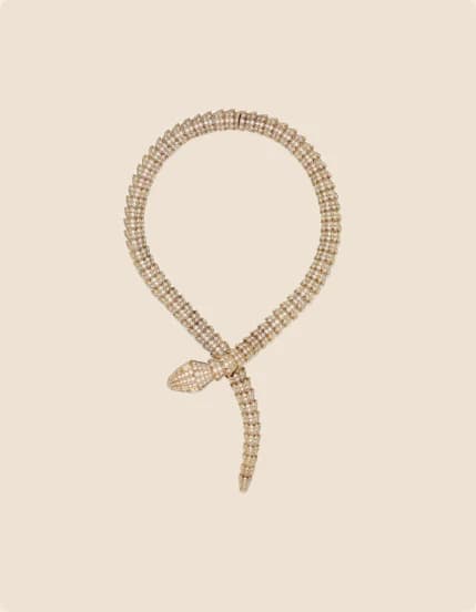 A pavé-set gold serpent bangle