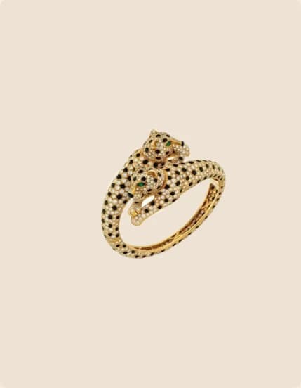 A gold panther ring with black enamel spots