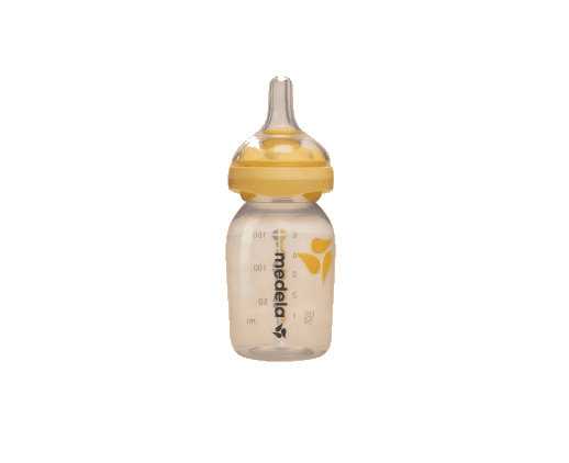 A glass baby bottle with a yellow teat