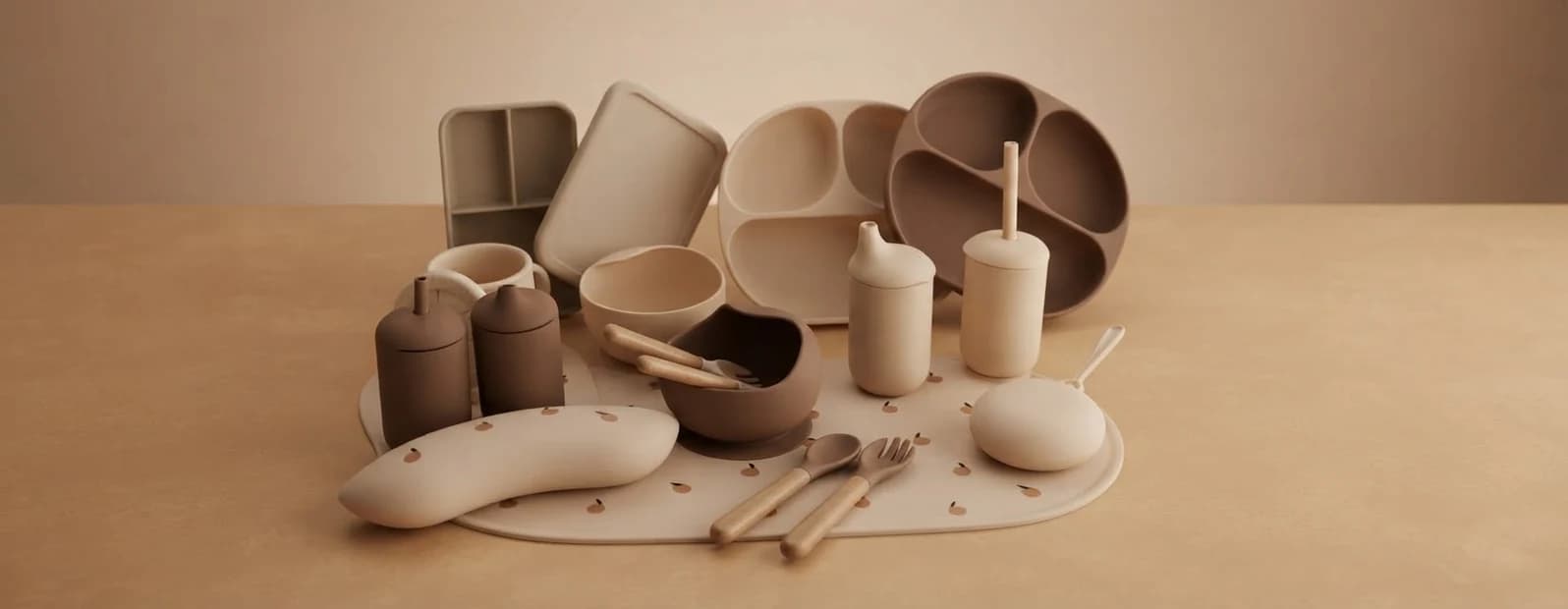 A silicone plate, bowl, cup and cutlery set