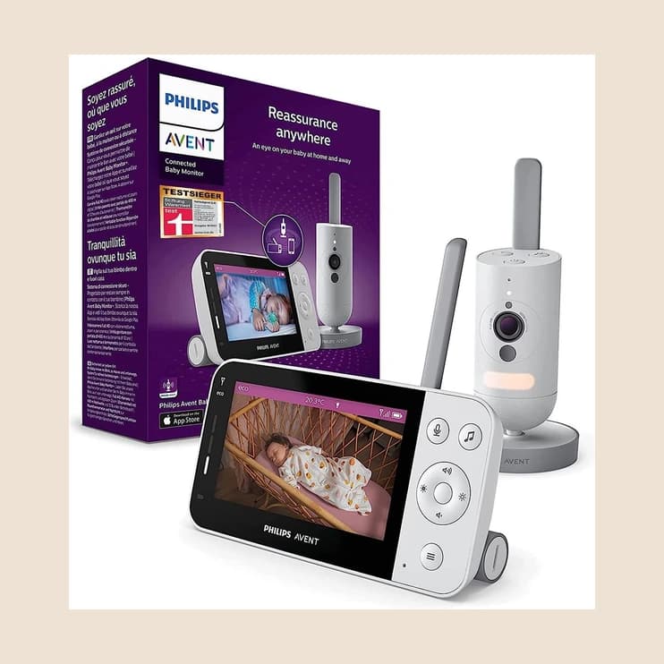 A video baby monitor beside its carton and camera unit