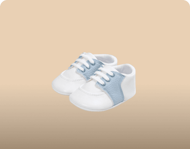 A pair of white baby trainers