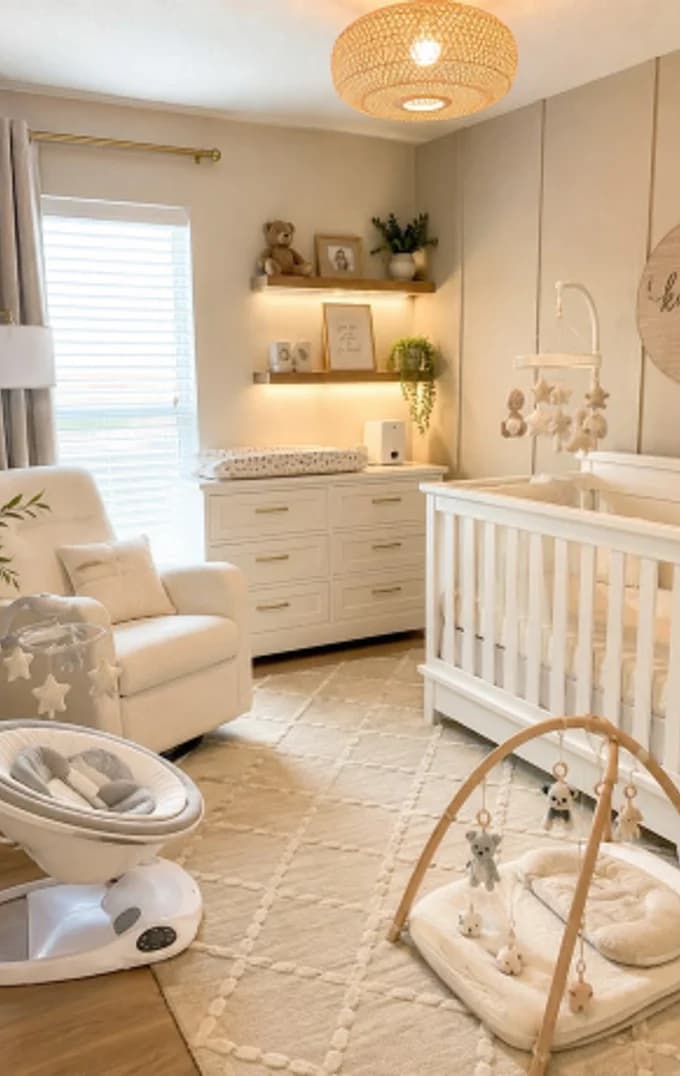 A nursery corner with a cot, a chair and a play gym