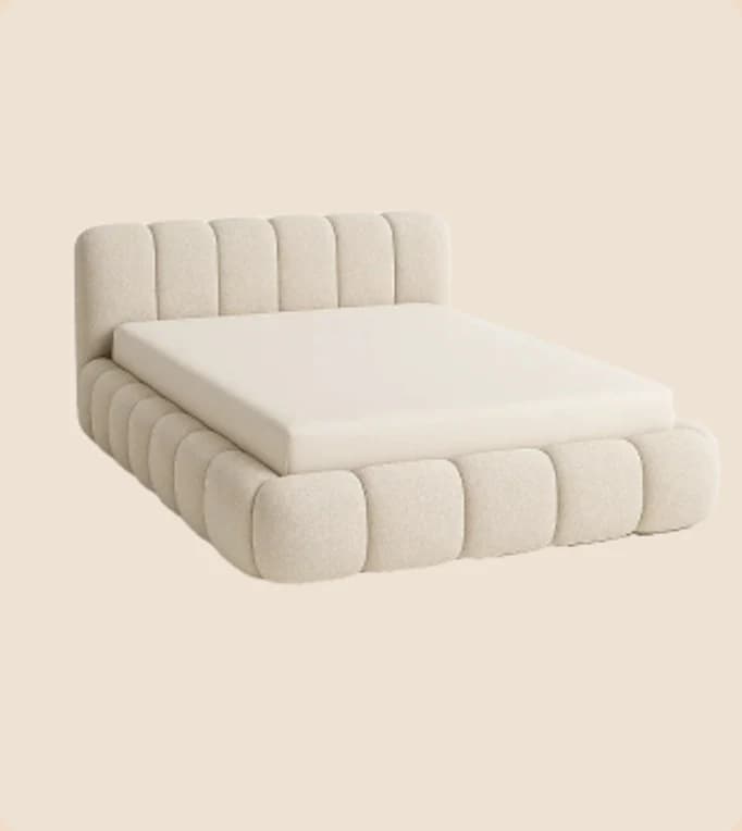 A cream channel-tufted platform bed