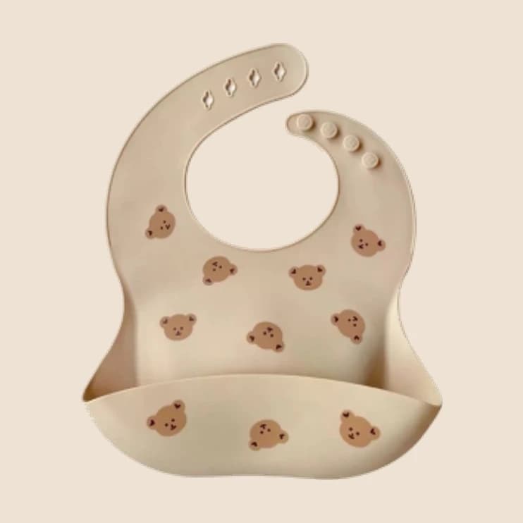 A soft clay-coloured silicone feeding bib